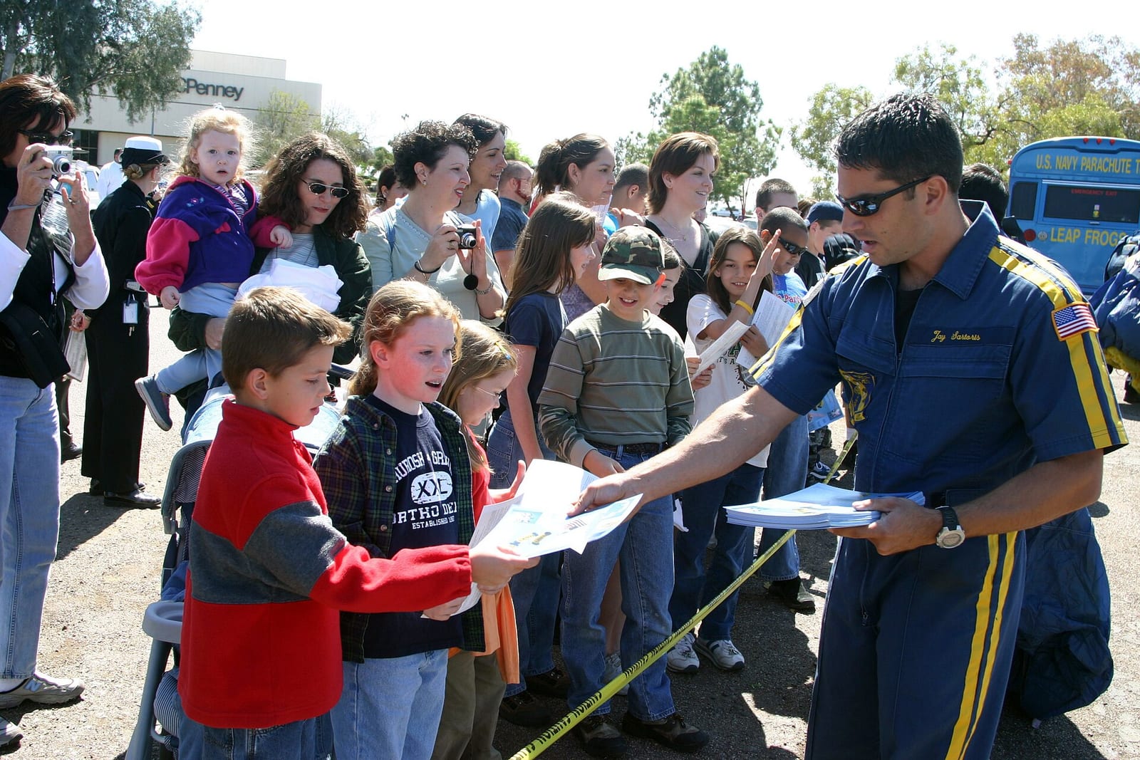 US Navy 050315-N-3271W-003 Hospital Corpsman 2nd Class Jay Sartoris, assigned to the U.S. Navy Leap Frogs parachute team, signs autographs at the MetroCenter Mall after completing an exhibition jump, 2005, Phoenix