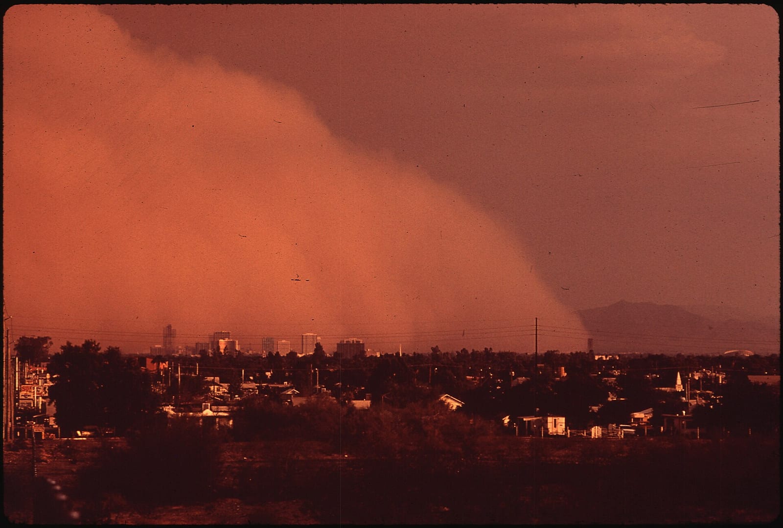 DUST STORM RISES ABOVE PHOENIX ON LABOR DAY, 1972. NO RAIN HAD FALLEN IN THE AREA FOR 153 DAYS, 1972, Phoenix