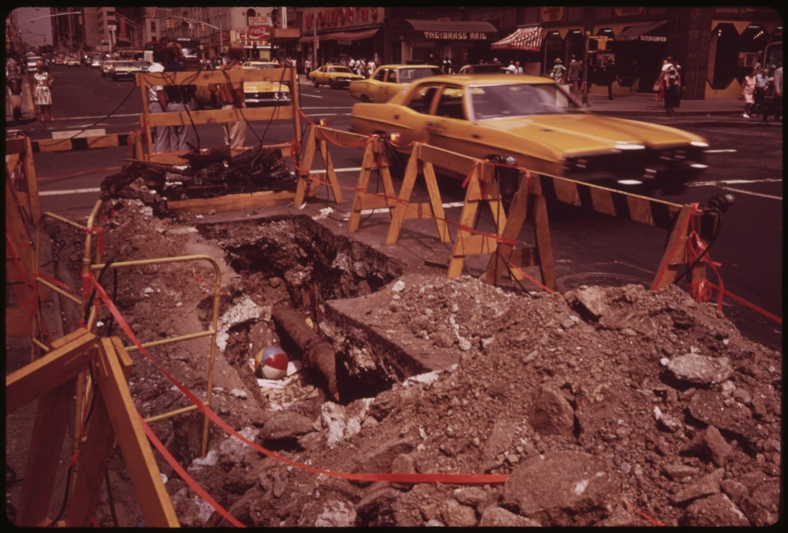 CONSOLIDATED EDISON AT WORK ON A MIDTOWN MANHATTAN STREET, 1973, New York City