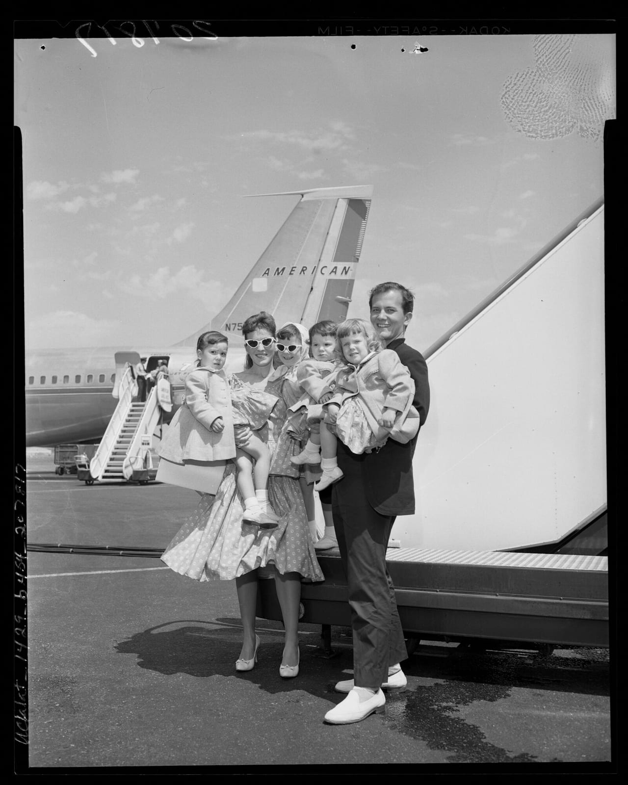 Singer Pat Boone with wife Shirley and their four children after disembarking plane in Los Angeles, Calif., 1959, 1959, Los Angeles