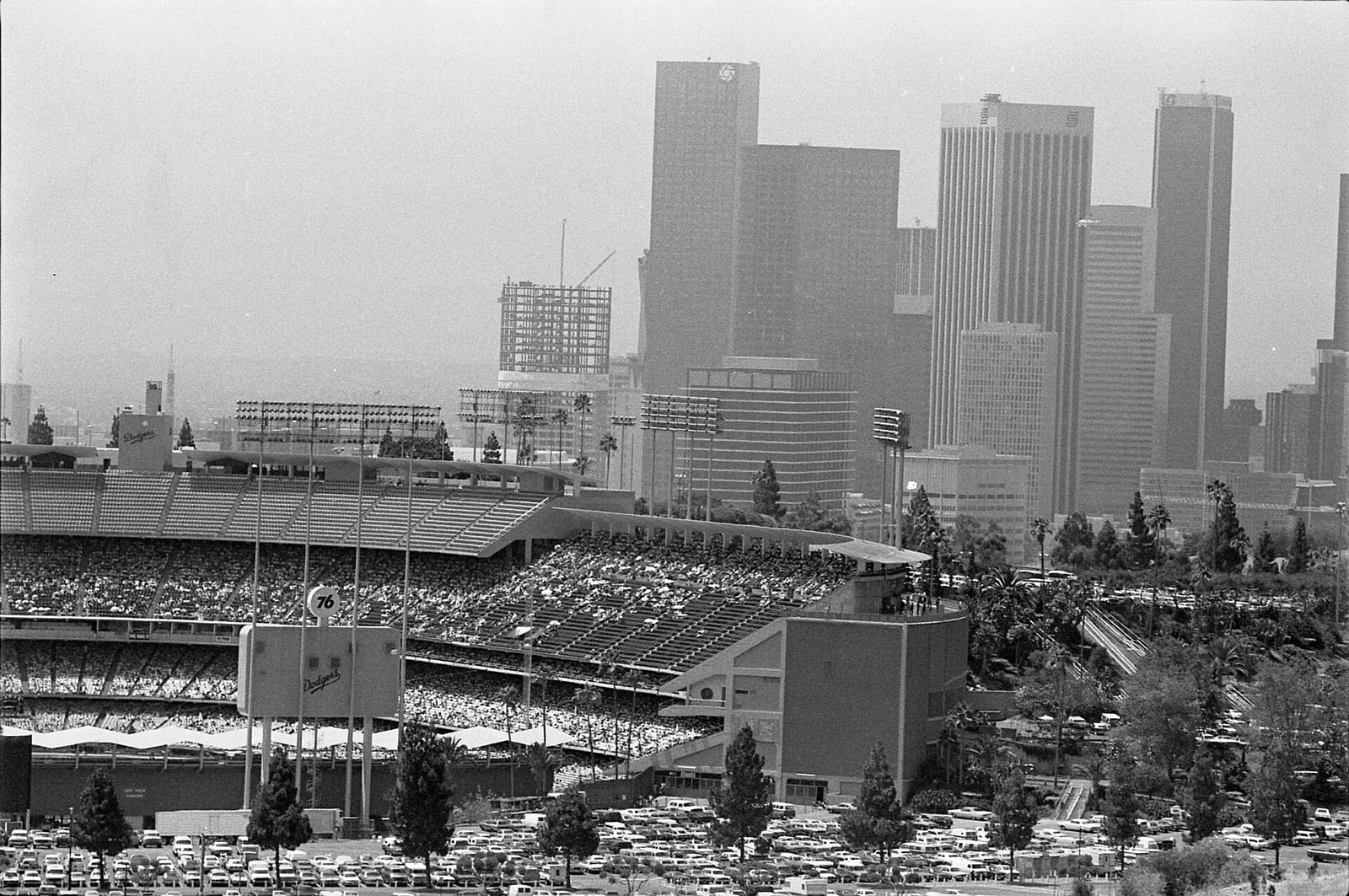 Cityscape of Dodger Stadium with skyline of downtown Los Angeles in background, 1984, Los Angeles
